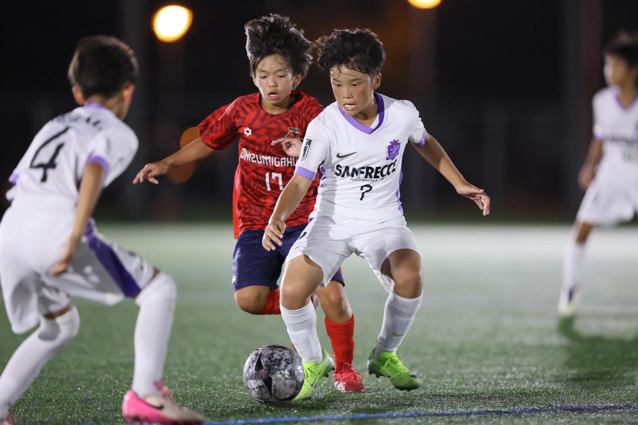 Young player walking towards stadium lights